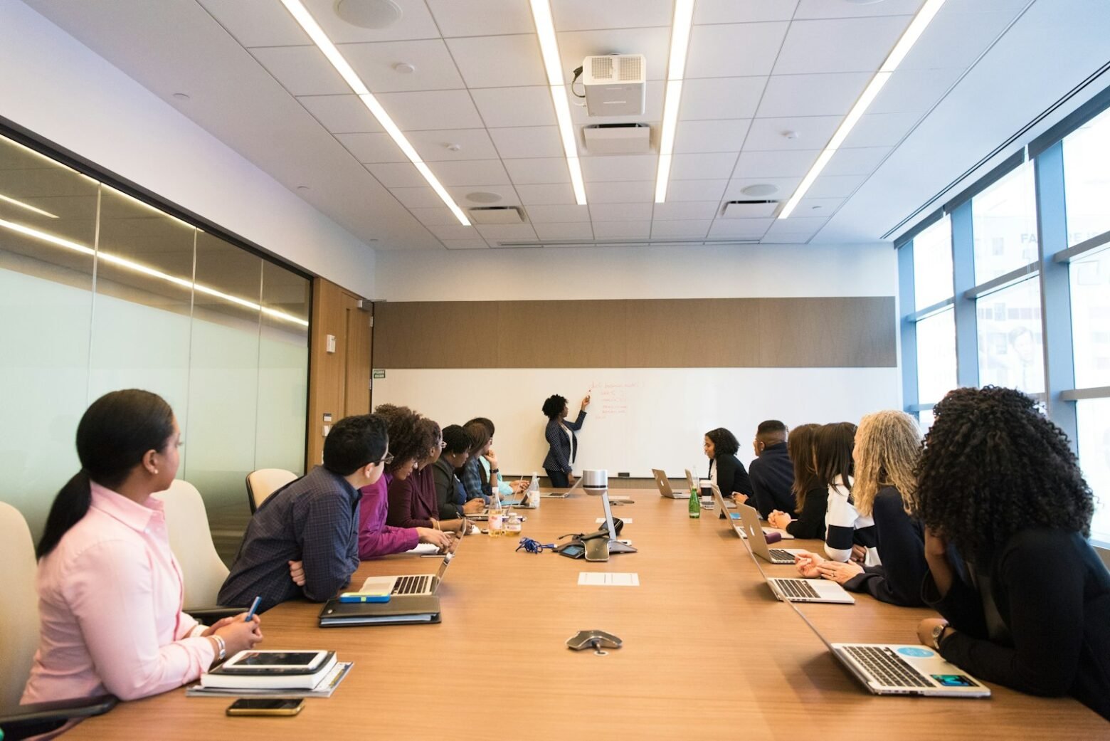 Executives in a boardroom discussing technology strategy