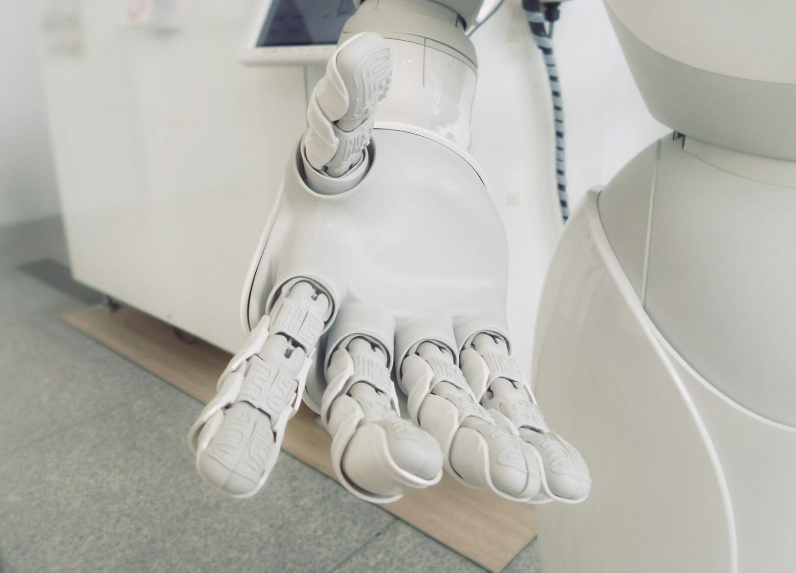 White robotic arm representing machine learning and automation