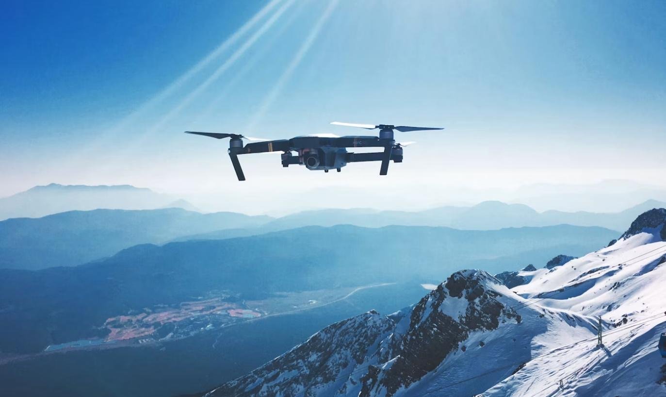 Autonomous drone flying over mountains on deployment